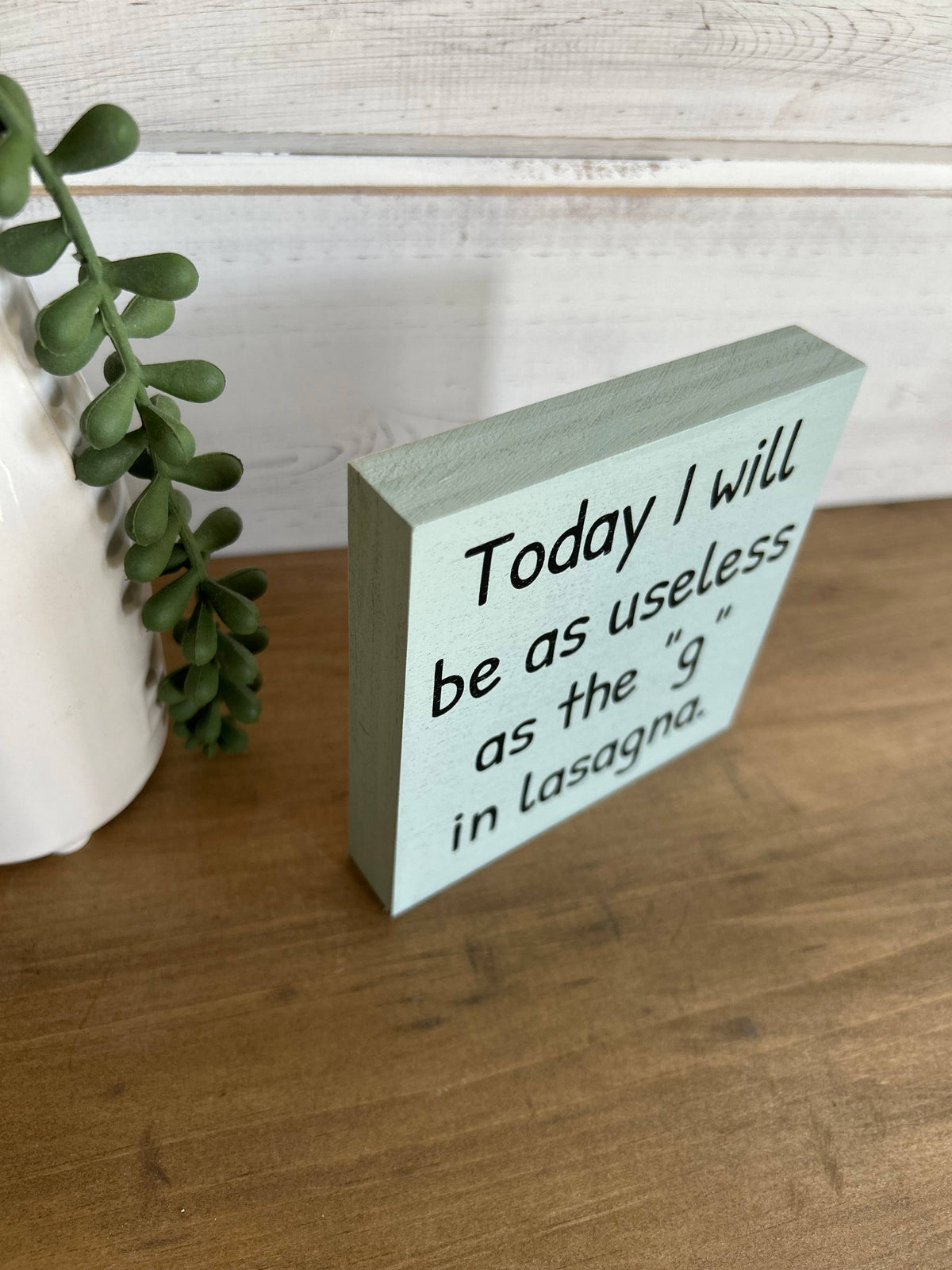 Useless as the “g” in Lasagna Wood Sign